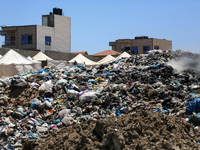 A view is showing piles of garbage amid the ongoing conflict in Gaza between Israel and Hamas, in Deir Al-Balah, in the central Gaza Strip,...