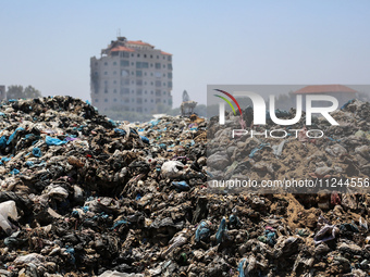 A view is showing piles of garbage amid the ongoing conflict in Gaza between Israel and Hamas, in Deir Al-Balah, in the central Gaza Strip,...