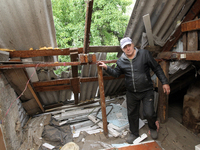 A displaced man from Avdiivka, Donetsk region, is being pictured in a house damaged by the falling debris of a Russian rocket in Dnipro, Ukr...