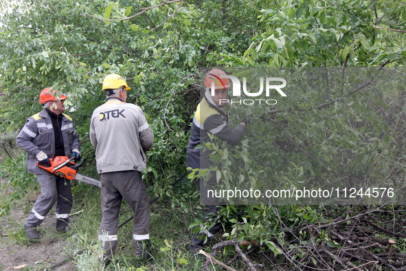 Electricians are dealing with damage caused by the falling debris of a Russian rocket in Dnipro, Ukraine, on May 15, 2024. NO USE RUSSIA. NO...