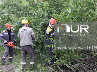 Electricians are dealing with damage caused by the falling debris of a Russian rocket in Dnipro, Ukraine, on May 15, 2024. NO USE RUSSIA. NO...