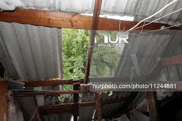 The roof of a house is being damaged by the falling debris of a Russian rocket in Dnipro, Ukraine, on May 15, 2024. NO USE RUSSIA. NO USE BE...