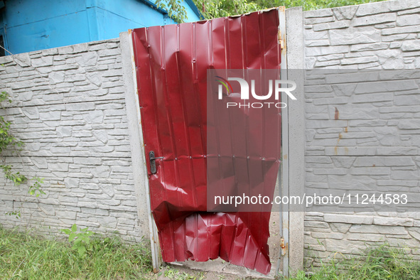 A fence is being damaged by the falling debris of a Russian rocket in Dnipro, Ukraine, on May 15, 2024. NO USE RUSSIA. NO USE BELARUS. 