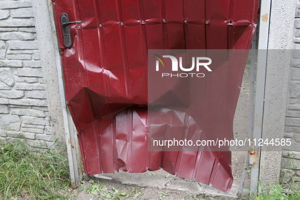 A fence is being damaged by the falling debris of a Russian rocket in Dnipro, Ukraine, on May 15, 2024. NO USE RUSSIA. NO USE BELARUS. 