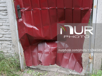 A fence is being damaged by the falling debris of a Russian rocket in Dnipro, Ukraine, on May 15, 2024. NO USE RUSSIA. NO USE BELARUS. (