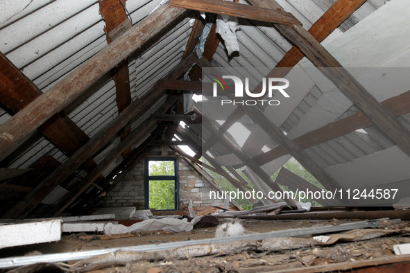 The roof of a house is being damaged by the falling debris of a Russian rocket in Dnipro, Ukraine, on May 15, 2024. NO USE RUSSIA. NO USE BE...