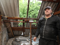 A displaced man from Avdiivka, Donetsk region, is being pictured in a house damaged by the falling debris of a Russian rocket in Dnipro, Ukr...