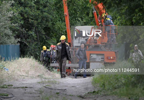 Electricians are dealing with damage caused by the falling debris of a Russian rocket in Dnipro, Ukraine, on May 15, 2024. NO USE RUSSIA. NO...