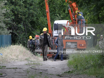 Electricians are dealing with damage caused by the falling debris of a Russian rocket in Dnipro, Ukraine, on May 15, 2024. NO USE RUSSIA. NO...