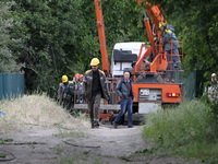 Electricians are dealing with damage caused by the falling debris of a Russian rocket in Dnipro, Ukraine, on May 15, 2024. NO USE RUSSIA. NO...