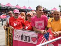 People showing a banner with typical Abruzzo arrosticini meat prior to the 107th Giro d'Italia 2024, Stage 12, a 193km stage from Martinsicu...