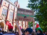 Students and activists attend solidarity with Palestine demonstration in front of Jagiellonian University building in Krakow, Poland on May...