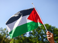 Palestinian flag is seen during solidarity with Palestine demonstration in front of Jagiellonian University building in Krakow, Poland on Ma...