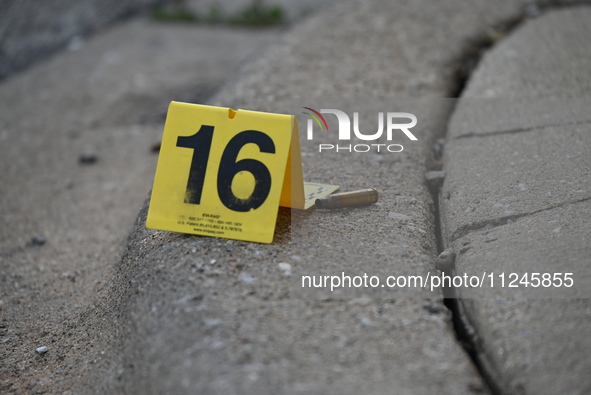 A shell casing is being discovered at the crime scene, tagged with an evidence marker. A 26-year-old male victim is being injured in a shoot...