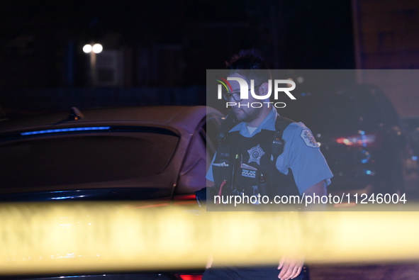 A police officer is overlooking the crime scene on Thursday evening. A 29-year-old male victim is dying after being shot multiple times in C...