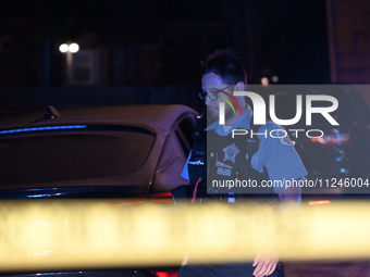 A police officer is overlooking the crime scene on Thursday evening. A 29-year-old male victim is dying after being shot multiple times in C...