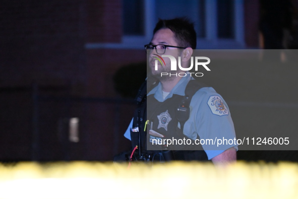 A police officer is overlooking the crime scene on Thursday evening. A 29-year-old male victim is dying after being shot multiple times in C...