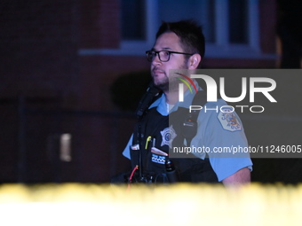 A police officer is overlooking the crime scene on Thursday evening. A 29-year-old male victim is dying after being shot multiple times in C...