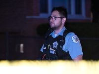 A police officer is overlooking the crime scene on Thursday evening. A 29-year-old male victim is dying after being shot multiple times in C...