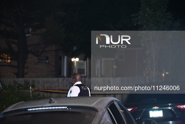 A police officer is overlooking the crime scene on Thursday evening. A 29-year-old male victim is dying after being shot multiple times in C...