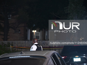 A police officer is overlooking the crime scene on Thursday evening. A 29-year-old male victim is dying after being shot multiple times in C...