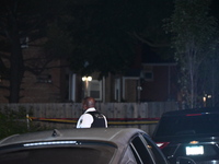 A police officer is overlooking the crime scene on Thursday evening. A 29-year-old male victim is dying after being shot multiple times in C...