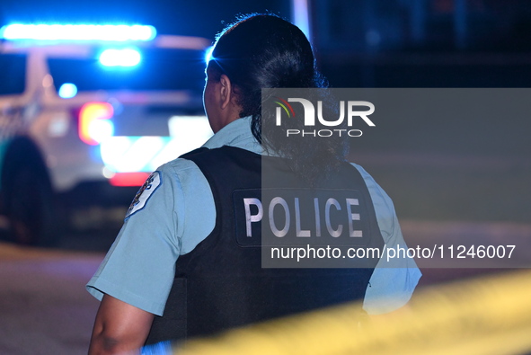 A police officer is overlooking the crime scene on Thursday evening. A 29-year-old male victim is dying after being shot multiple times in C...