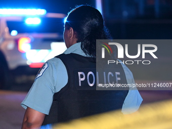 A police officer is overlooking the crime scene on Thursday evening. A 29-year-old male victim is dying after being shot multiple times in C...