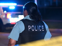 A police officer is overlooking the crime scene on Thursday evening. A 29-year-old male victim is dying after being shot multiple times in C...