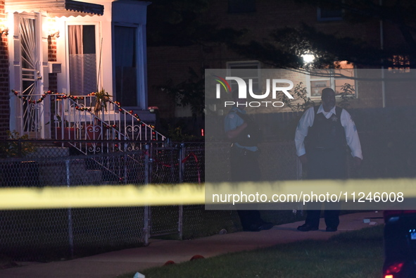 A police officer is overlooking the crime scene on Thursday evening. A 29-year-old male victim is dying after being shot multiple times in C...