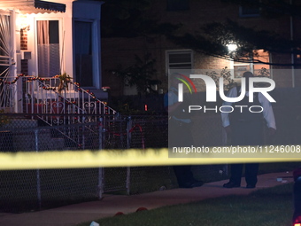 A police officer is overlooking the crime scene on Thursday evening. A 29-year-old male victim is dying after being shot multiple times in C...