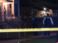 A police officer is overlooking the crime scene on Thursday evening. A 29-year-old male victim is dying after being shot multiple times in C...