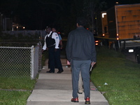 Police officers are gathering at the crime scene. A 29-year-old male victim is dying after being shot multiple times in Chicago, Illinois, U...