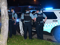 Police officers are gathering at the crime scene. A 29-year-old male victim is dying after being shot multiple times in Chicago, Illinois, U...