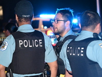 Police officers are gathering at the crime scene. A 29-year-old male victim is dying after being shot multiple times in Chicago, Illinois, U...