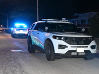 Police vehicles are at the crime scene on Thursday evening. A 29-year-old male victim is dying after being shot multiple times in Chicago, I...