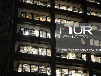 Many windows are being blown out of an office building at 1001 Louisiana Street in Houston, Texas, on May 16, 2024. (