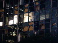 Wells Fargo Plaza is having many of its blown-out and broken windows boarded up after the storm in City, Country, on May 16, 2024. (