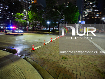 Streets are being blocked off by police as the cleanup crew is managing the aftermath of the storm in City, Country, on May 16, 2024. (