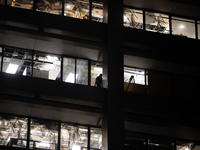 A worker is surveying the damage from inside 1001 Louisiana St. after the storm in Houston, Texas, on May 16, 2024. (