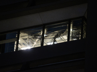 Blinds are being twisted out of place inside 1001 Louisiana St. from the high winds in Houston, Texas, on May 16, 2024. (