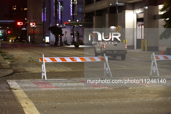 Shattered glass is covering the roads of downtown Houston, Texas, on May 16, 2024. 