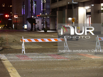 Shattered glass is covering the roads of downtown Houston, Texas, on May 16, 2024. (