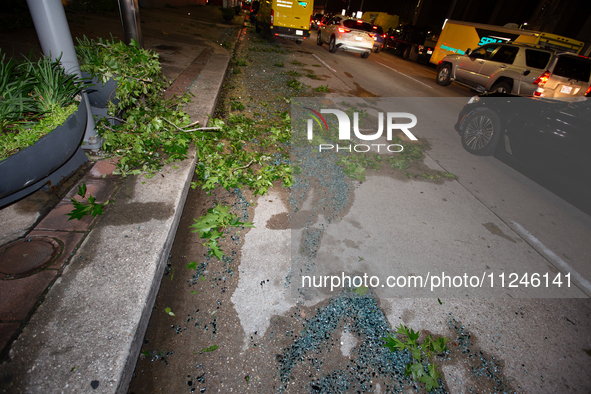 Shattered glass is covering the roads of downtown Houston, Texas, on May 16, 2024. 