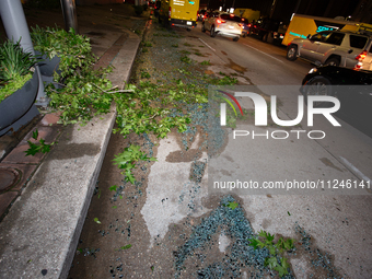 Shattered glass is covering the roads of downtown Houston, Texas, on May 16, 2024. (