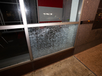 A window is shattering in downtown Houston, Texas, on May 16, 2024. (