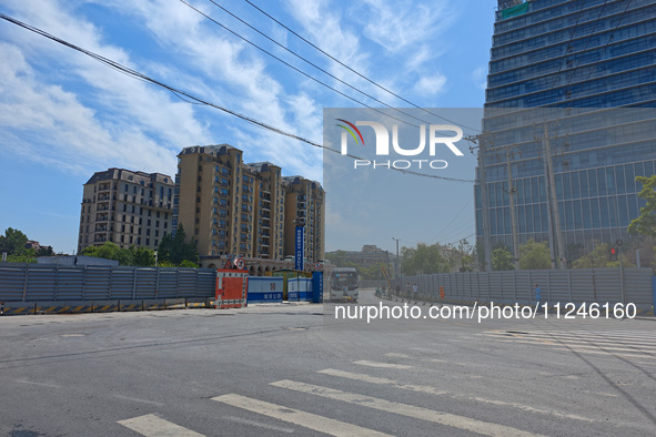 The area around the construction site where a fire is breaking out is now returning to normal in Shanghai, China, on May 17, 2024. 