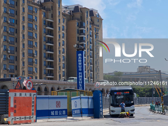 The area around the construction site where a fire is breaking out is now returning to normal in Shanghai, China, on May 17, 2024. (