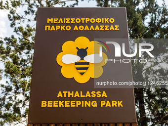 The sign at the entrance of the park is being seen first by visitors in Nicosia, Cyprus, on April 12, 2024. Bees are being considered a valu...