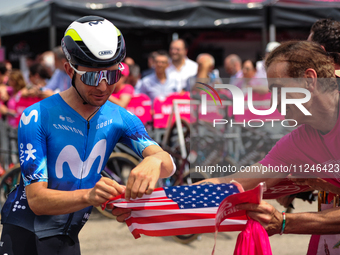 Pelayo Sanchez of Spain and Movistar Team signing autographs to fans prior to the 107th Giro d'Italia 2024, Stage 12, a 193km stage from Mar...